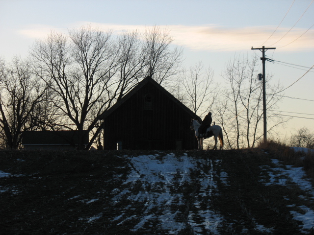 Trail Riding in the snow at sunset through the fields and farms of Upstate New York